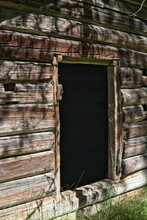 Empty Entrance Of Old Log Cabin
