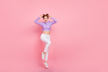 Poster - Full length body size view of attractive cheery thin girl jumping having fun isolated over pink pastel color background