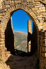 Wall Mural - beautiful stone arch in the ruins of the abandoned ancient village of Gamsutl, Dagestan