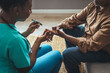 © Dragana Gordic - Young nurse doing a glucose blood test on her senior patient, during a home visit. Theme diabetes. The man whose glucose was measured by going to the home of healthcare professionals.