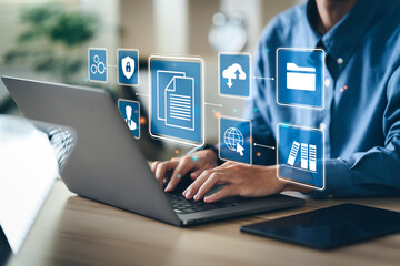 Businessman using a computer to document management concept, online documentation database and digital file storage system/software, records keeping, database technology, file access, doc sharing.