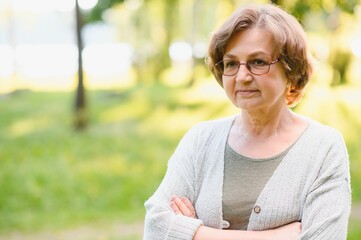 Sticker - Portrait of a happy Senior woman in summer park