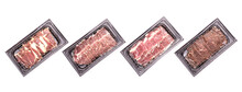 Set Of Raw Sliced Dry Aged Beef In Black Plastic Tray Isolated On White
