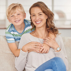 portrait of a single mother and her son. adorable boy bonding with his single parent and hugging her