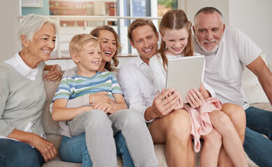 Poster - Happy family using a digital tablet in the living room at home. Cute little girl and boy bonding with parents and grandparents in the lounge. Watching a movie and using technology for a video call