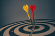 © czchampz - Close up shot of the dart arrow hit on bulleyes of dartboard to represent that the business reached the target of company with dark tone picture style. Target and goal as concept.