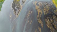 Aerial View Of Water Formation Along The Coastline At River Estuary In Iceland.