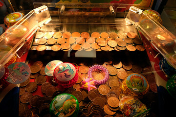 Two pence coins in an amusement arcade machine.