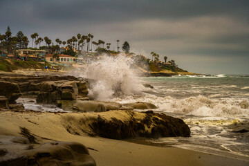 Wall Mural - 2022-07-04 WAVES CRASHING ON THE SHORELINE AT THE WINDANSEA BEACH IN LA JOLLA CALIFORNIA WITH PALM TREES AND A NICE SKY