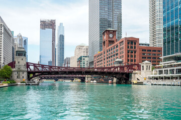 View from the river cruise in Chicago, Illinois. Many beautiful, unique buildings. One skyscraper is being built.