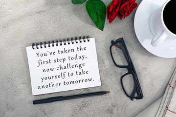 Wall Mural - Motivational and inspirational quote on notebook on white marble table.