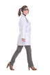© ASDF - Full length portrait of medical doctor woman going sideways