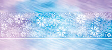 Elegant Frosted White Snowflake Border Against A Purple And Blue  Motion Blurred Background. Wide Panoramic Snowflake Banner For Social Media. Winter Wonderland Scene.