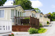© Eileen - Row of static mobile homes on caravan site in rural Wales, places where people come to relax and vacation away from the stresses of the world.