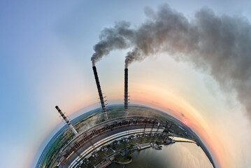 Wall Mural - Aerial view from high altitude of little planet earth with coal power plant high pipes with black smokestack polluting atmosphere. Electricity production with fossil fuel concept