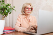 © Cavan - Portrait of a mature businesswoman with glasses.