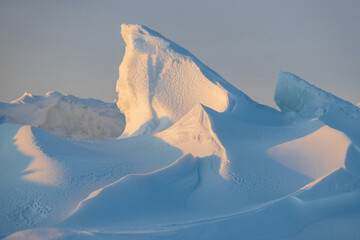 Wall Mural - winter arctic landscape. ice hummocks on the frozen sea in the arctic. view of snow and ice at sunse