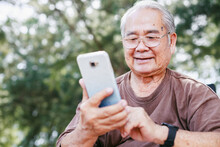 Elderly Man With Technology And Leisure Activity Concept. Asian  Retirement Elderly Using Smartphone