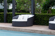 © Pornpawit - Modern sofa and furniture with pool.