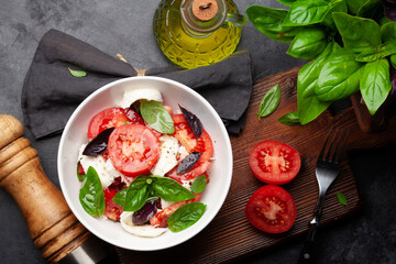 Canvas Print - Caprese salad with fresh tomatoes, basil and mozzarella cheese