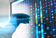 © Connect Images - Scientist matching DNA sample to results on screen