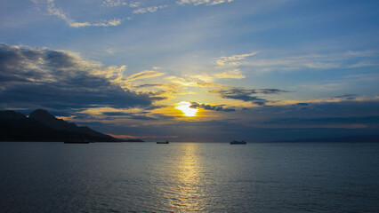 Sunset between two continents Africa and Europe, between two countries Morocco and Spain, in the mediterranean sea.