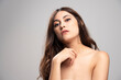 © rastockinc - Portrait of beautiful young woman standing and looking at camera