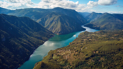 Wall Mural - Drone aerial footage of river Drina and Tara mountain landscape..