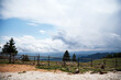 © astrosystem - Mountain and hill landscape with clouds and fields.