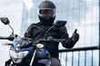 © Petro - Handsome motorcyclist on his moto riding in the city
