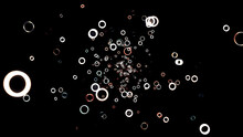 Abstract Animation Of White And Red Small Green Rings Floating On The Black Background. Animation. Circle Frames Flying Away In The Darkness And Disappear.