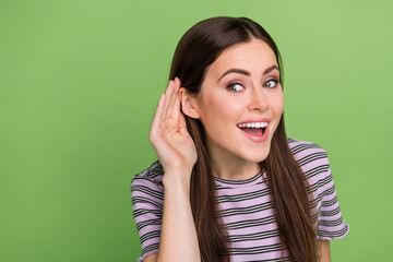 Poster - Portrait of attractive cheerful girly girl listening news copy blank space ad isolated over bright green color background