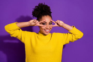 Sticker - Photo of cheerful friendly person arms demonstrate v-sign near eyes isolated on violet color background