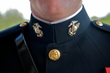Closeup Of A Groom's Marine Corps Uniform Symbols Dressed On His Wedding Day