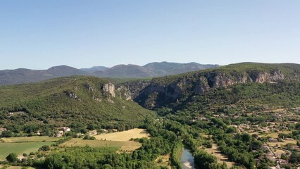 Wall Mural - survol de la rivière Hérault dans le sud de la France face aux cévennes