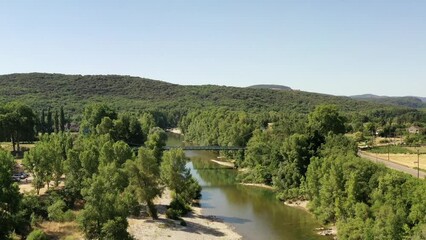 Wall Mural - survol de la rivière Hérault dans le sud de la France face aux cévennes