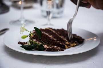 Canvas Print - Slice of a chocolate cake at the celebration table