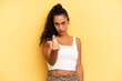 hispanic pretty woman feeling angry, annoyed, rebellious and aggressive, flipping the middle finger, fighting back