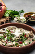 © Надія Коваль - Slow cooked pork stew with mushrooms in creamy sauce served with parsley. Restaurant menu, dieting, cookbook recipe top view