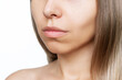 © Марина Демешко - Cropped shot of a young caucasian woman's lower part of the face with clear highlighted cheekbones isolated on a white background. Plastic surgery buccal fat removal. Result of cosmetic surgery