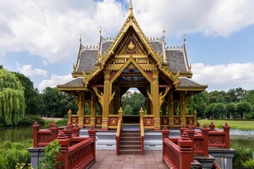 Canvas Print - Closeup shot of the Asian temple under the blue partly cloudy sky