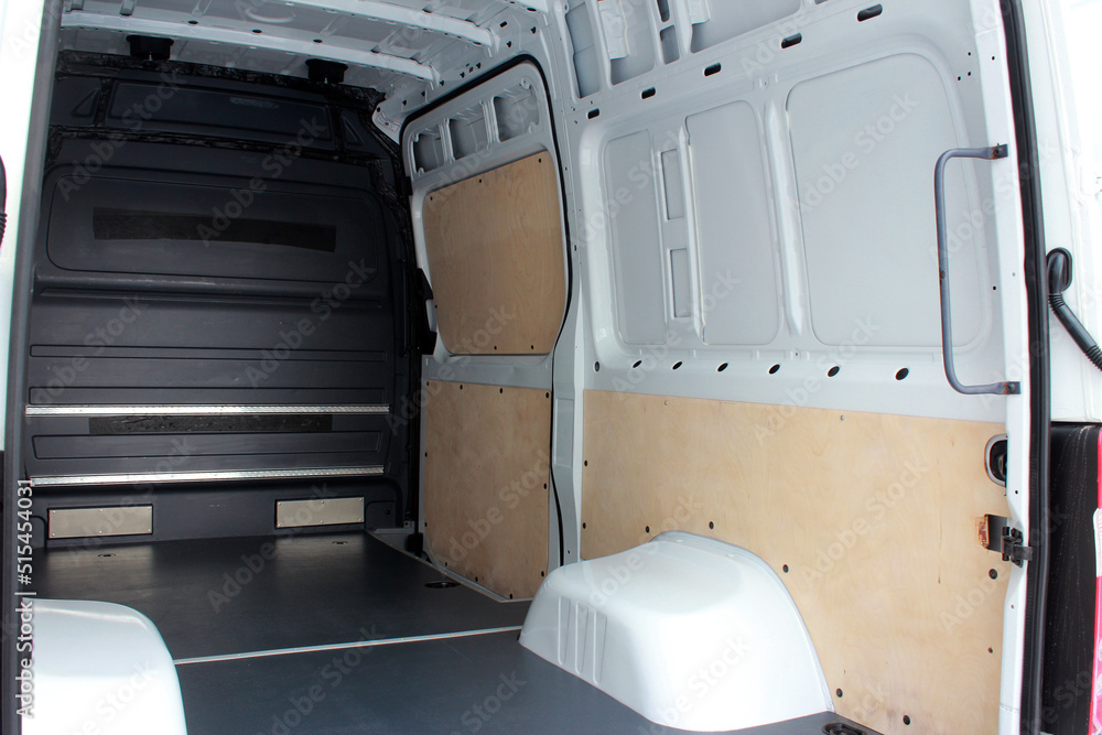 Trunk of a modern cargo van. Interior of a modern cargo van. Cargo van open trunk.