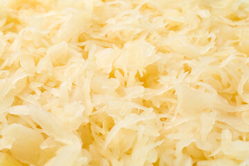 Tasty fermented cabbage as background, closeup view