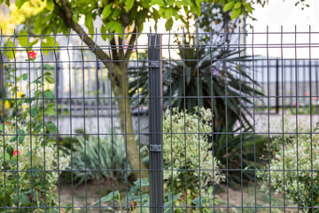 Wall Mural - Steel grating fence made with wire.
