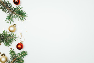 Wall Mural - fir branches christmas balls on a white background top view.