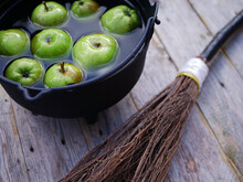 Apple Bobbing At Halloween With Witches Broomstick