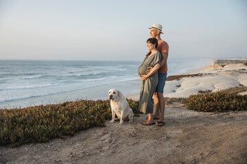 Wall Mural - Pregnant couple and their dog