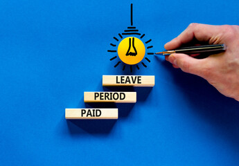 Paid period leave symbol. Concept words Paid period leave on wooden blocks. Beautiful blue table blue background. Doctor hand. Business medical paid period leave concept. Copy space.