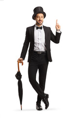 full length portrait of a young gentleman with a top hat leaning on umbrella and pointing up