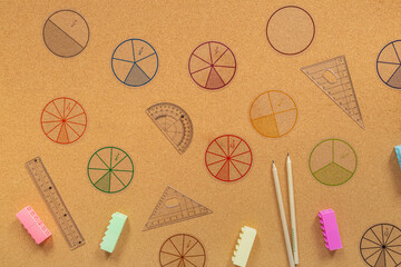 Wall Mural - Multicolored pieces of fractions on the table. Close up math material for study. Back to school, geometry lessons, mathematical education for preschooler. Creative study
